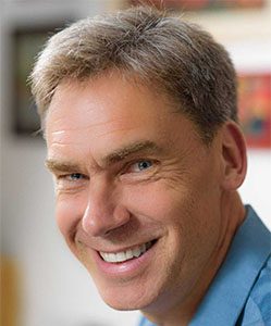 Headshot of Markus Brauer in a blue, collared shirt