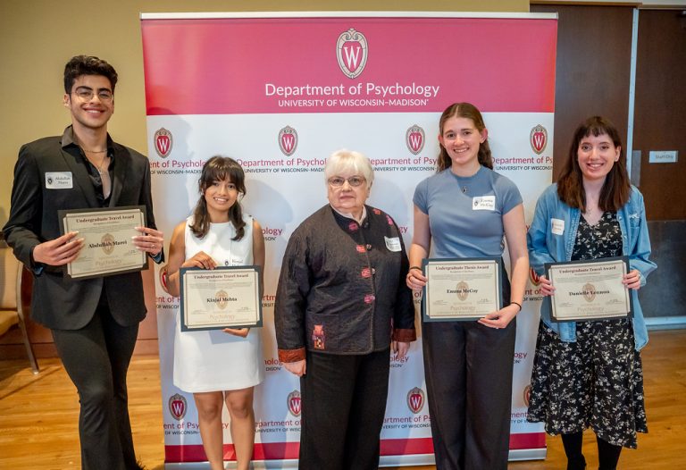 The four recipients of the Travel and Thesis Awards pose with alumna and donor Joyce Rosevear (center).